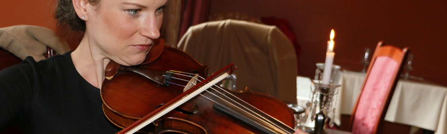 Laryssa Warne playing violin in downtown Calgary